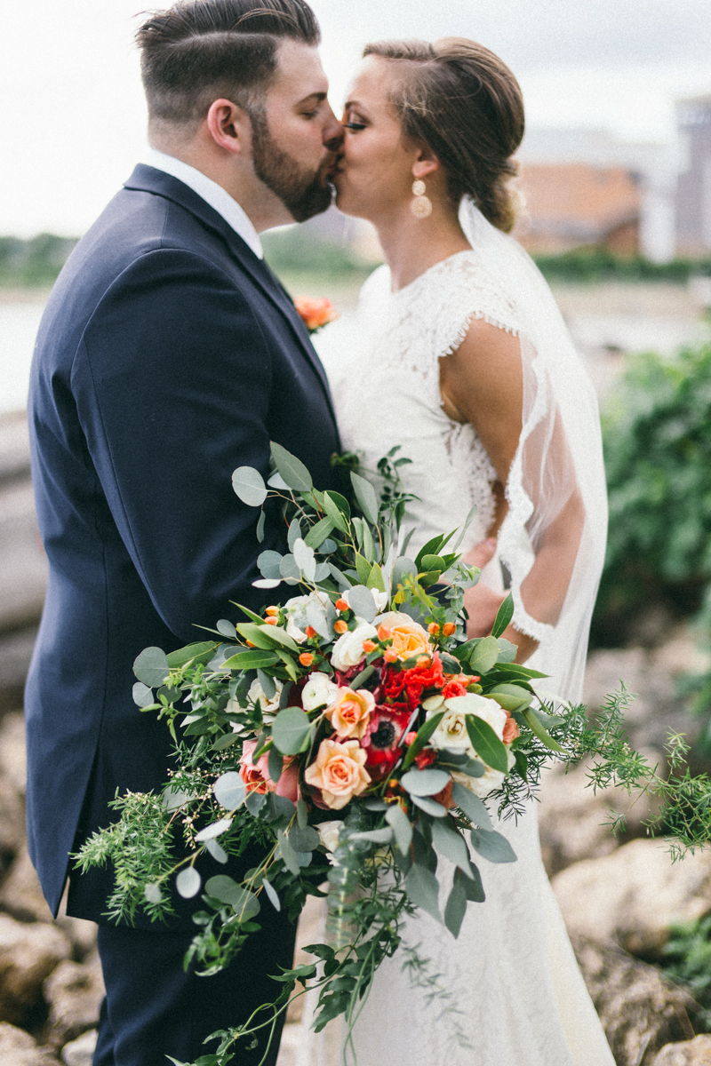 Bride and Groom on driftwood in St Paul Minnesota