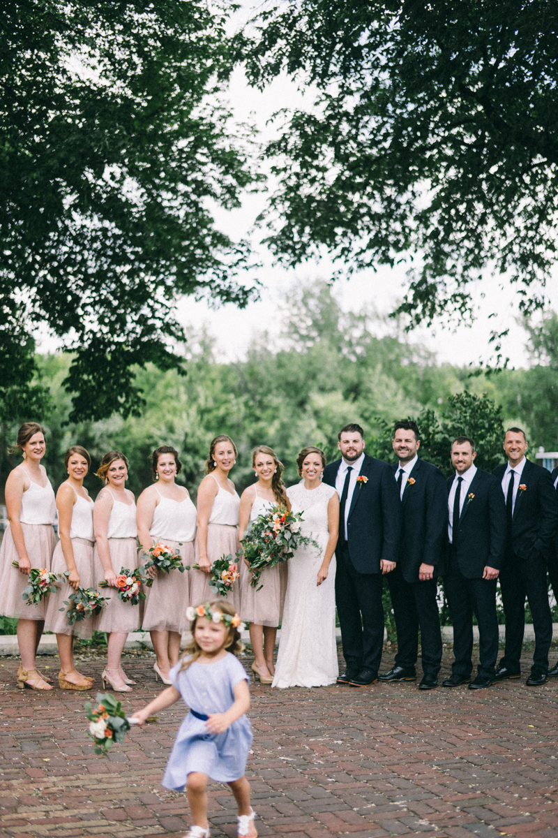 Flower girl running away from bridal party