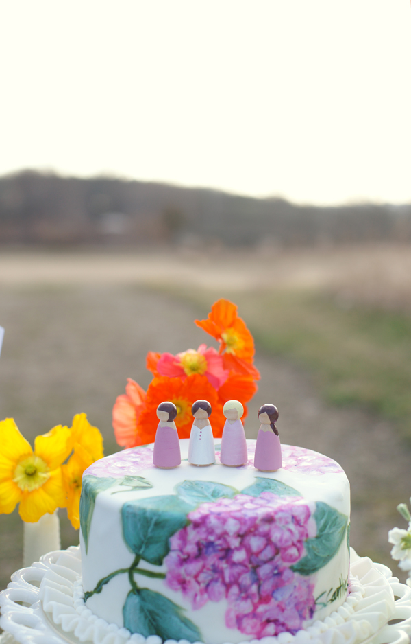 Wooden peg dolls on top of a hand painted bridesmaid cake | Maine Wedding & Portrait Photographer