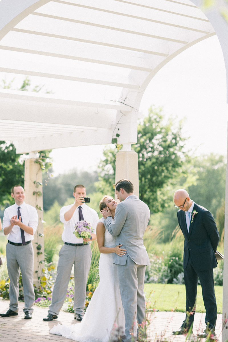 first kiss during ceremony at longfellow gardens
