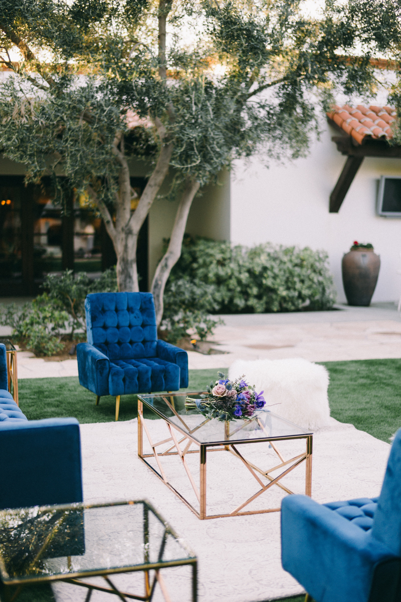 blue velvet wedding with purple flowers