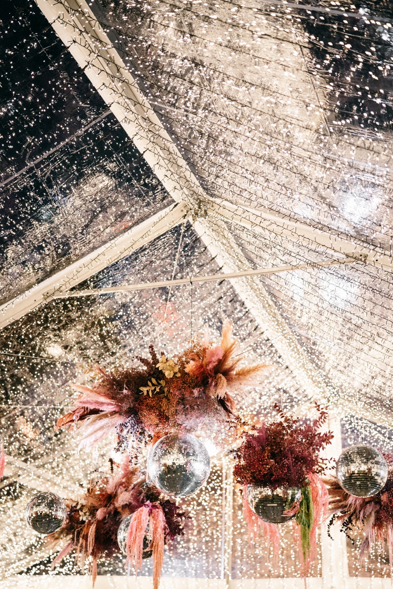 twinkle tent with disco balls and dried floral