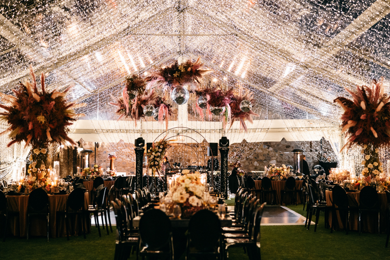 twinkle tent with disco balls and dried floral