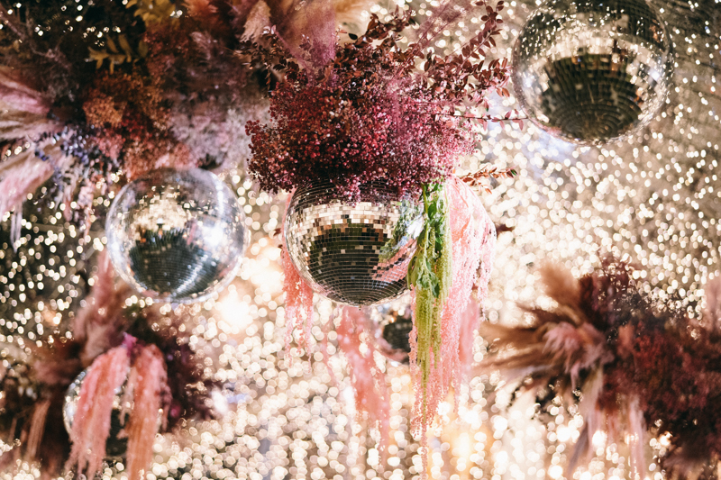 twinkle tent with disco balls and dried floral