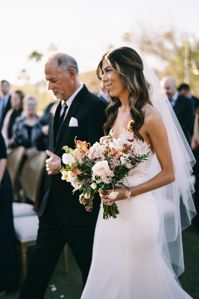 bride walking down the aisle at wedding