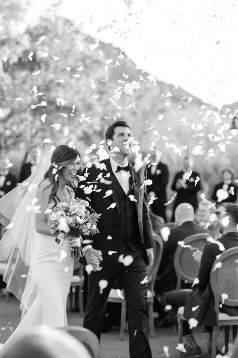 processional with flower petals at desert wedding