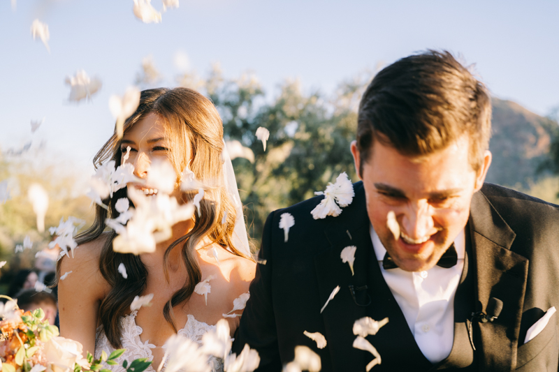 processional with flower petals at desert wedding