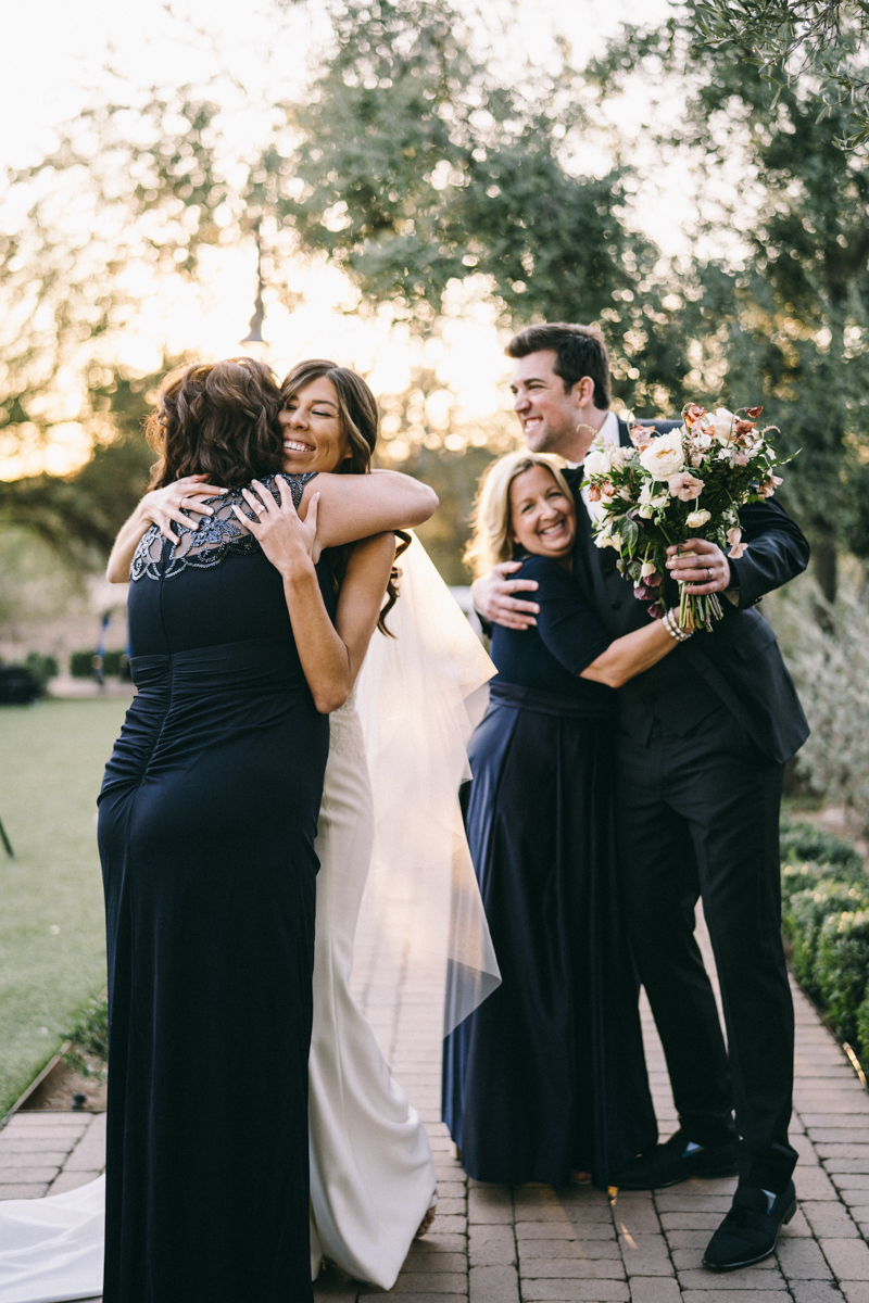 hugging parents after ceremony