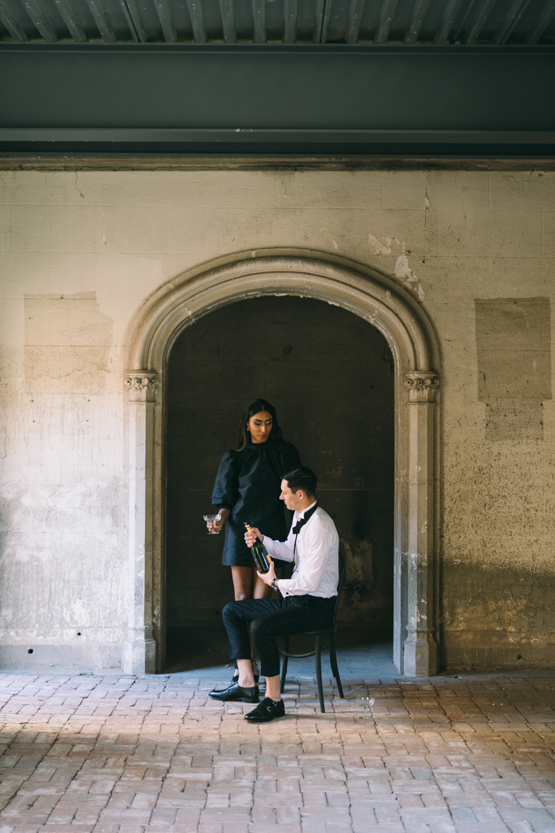 champagne toast in engagement photos