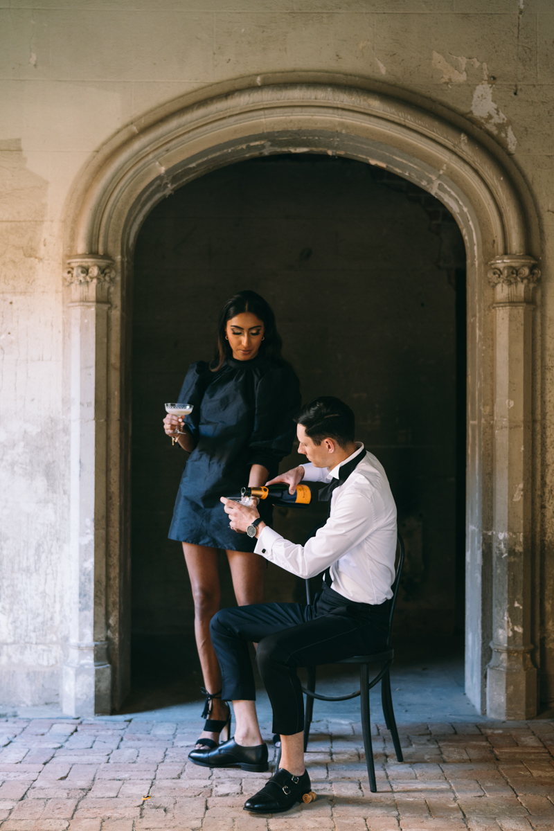 champagne toast in engagement photos