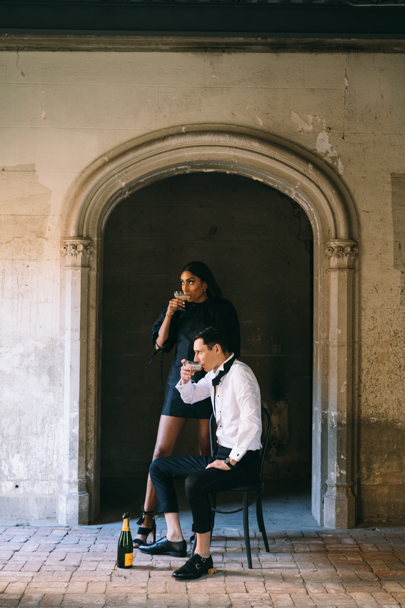 champagne toast in engagement photos