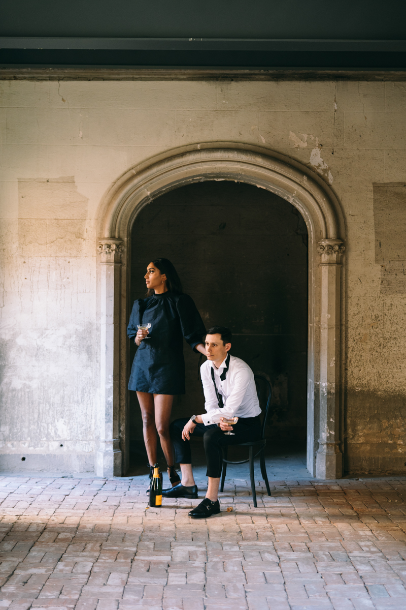 champagne toast in engagement photos