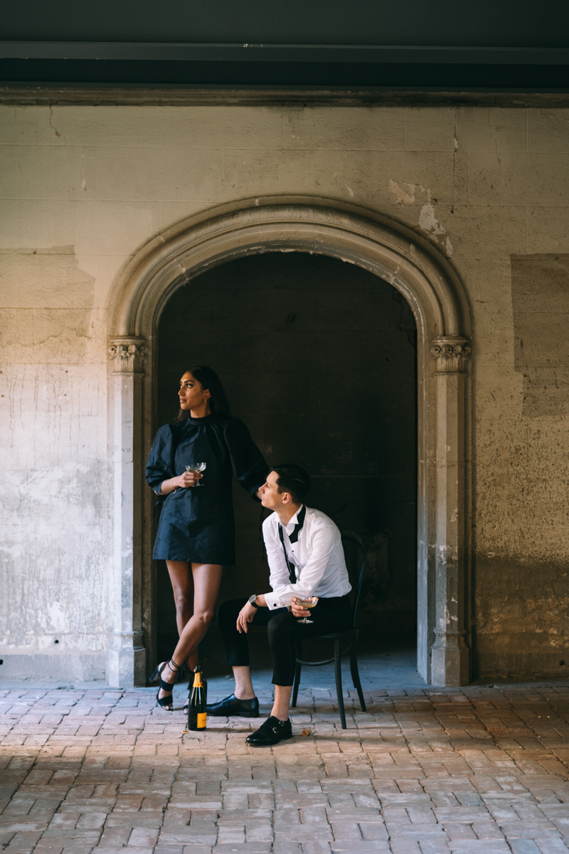 champagne toast in engagement photos