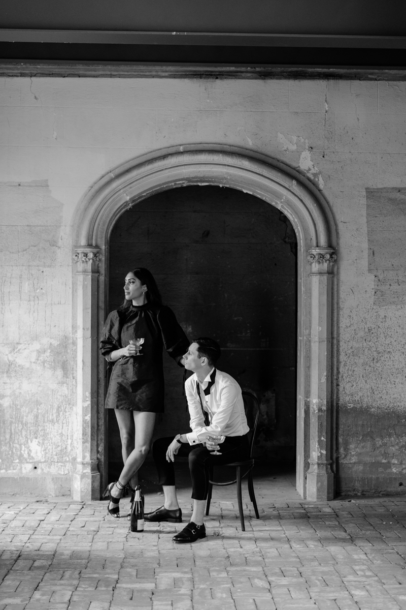 champagne toast in engagement photos