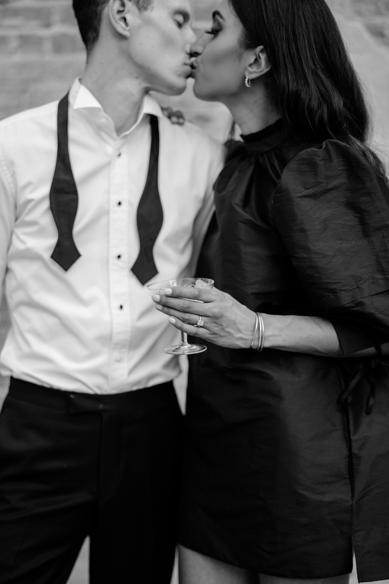 champagne toast in engagement photos