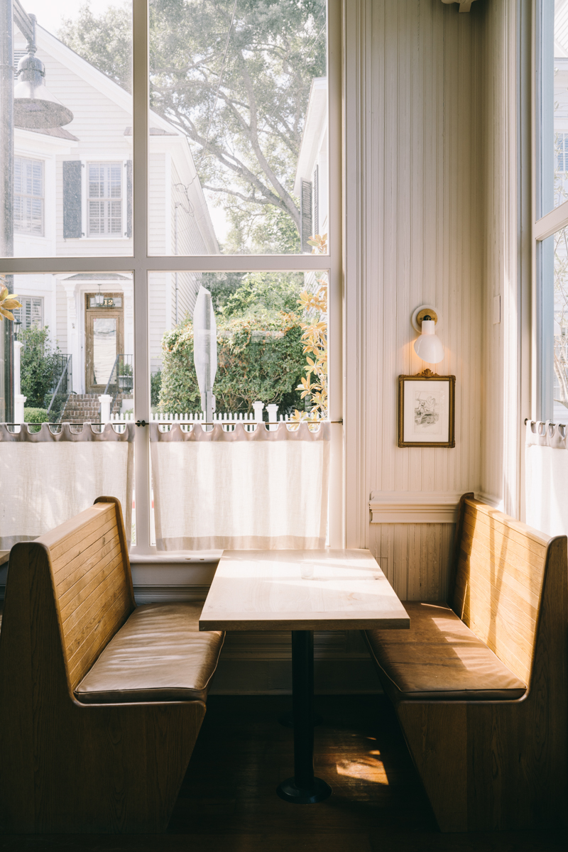 Empty restaurant booth with bright sunshine in the room