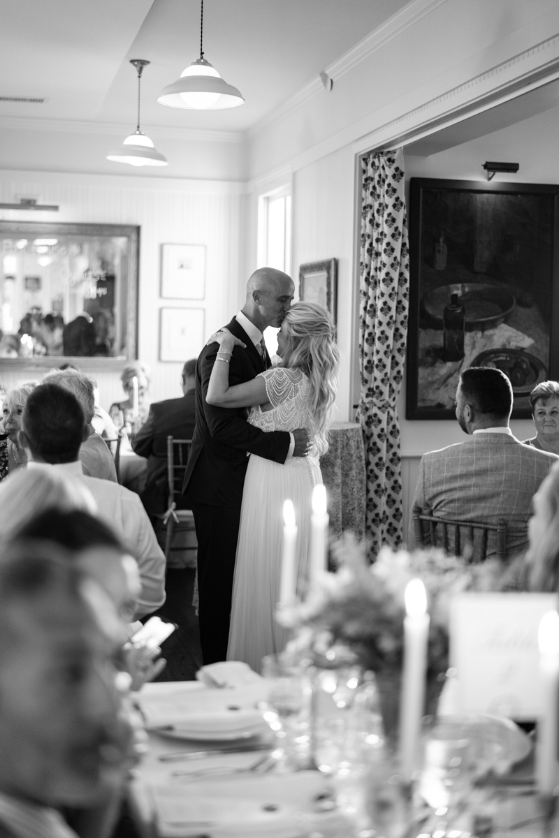 Bride and groom at wedding reception dancing