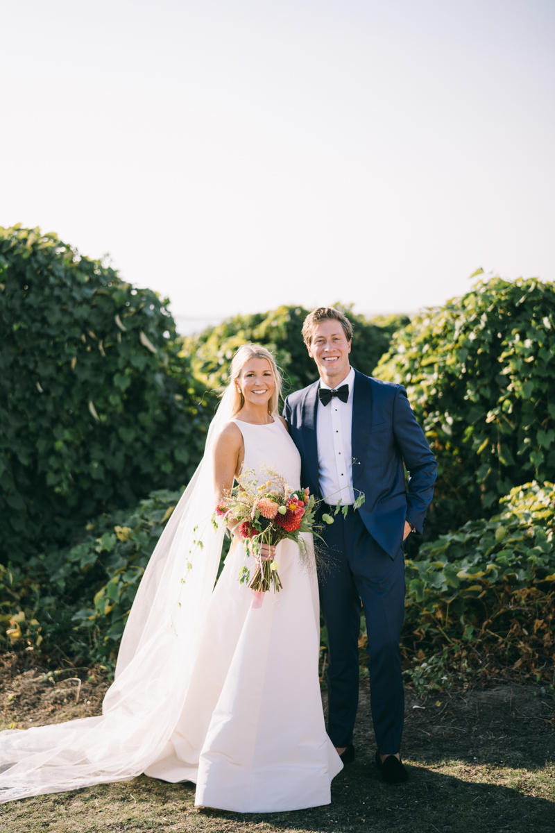 Bride and groom standing and smiling