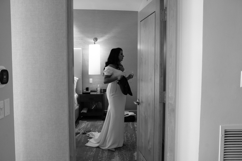 bride getting ready in her wedding dress