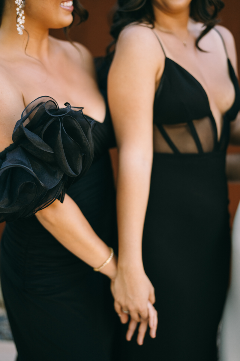 bridesmaids dresses with black puffy sleeves and another with a black corset