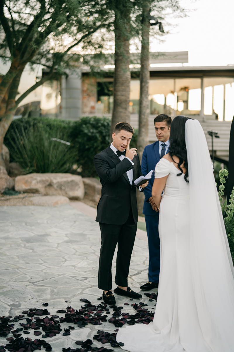 Groom crying at altar when he sees his bride as they exchange vows
