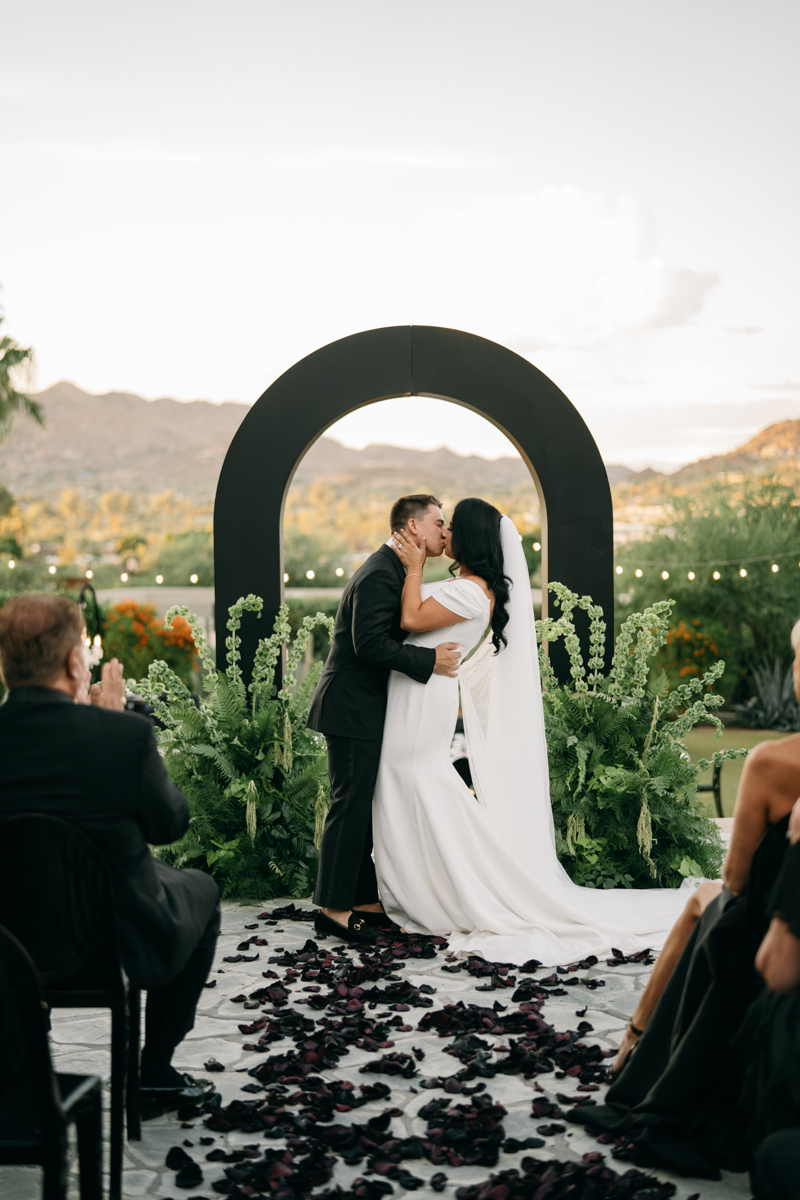 Bride and groom share their first kiss as husband and wife 