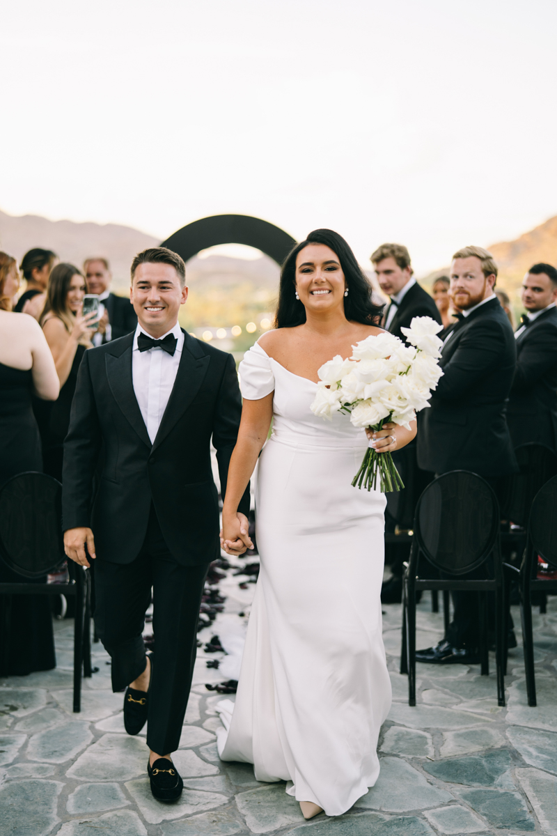 Bride and groom walk down the aisle as husband and wife at Scottsdale Wedding