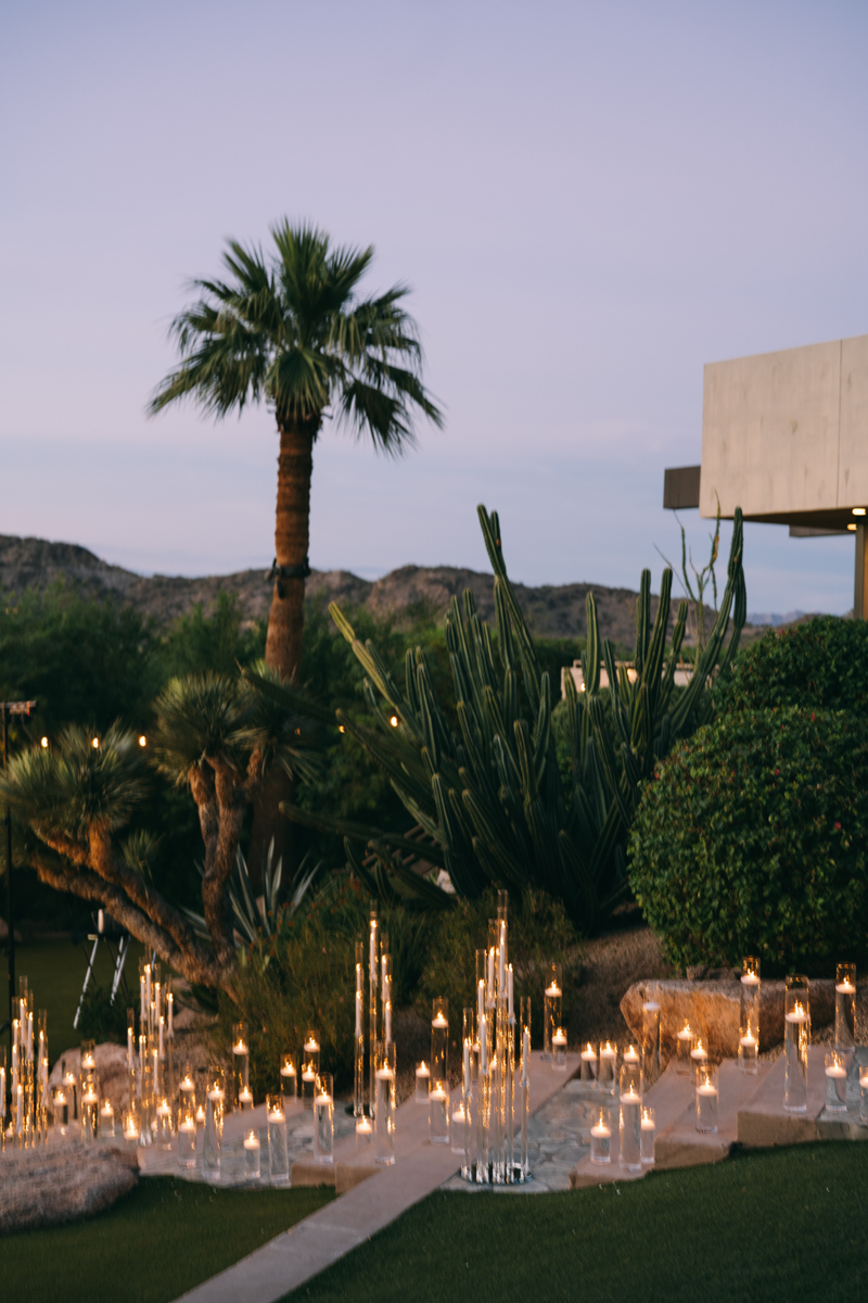 sunset in the desert with pillar candles