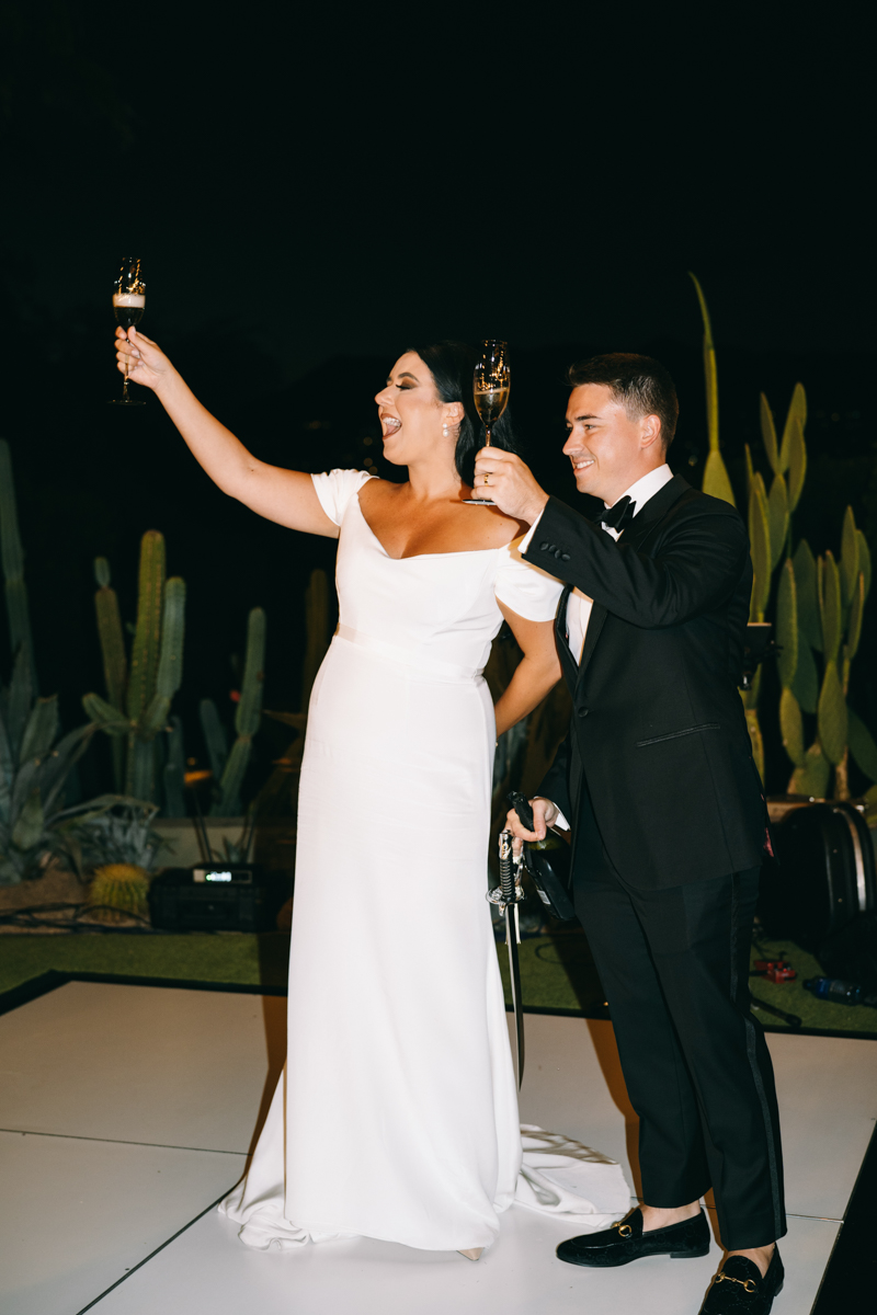 Bride and groom toasting their guests 