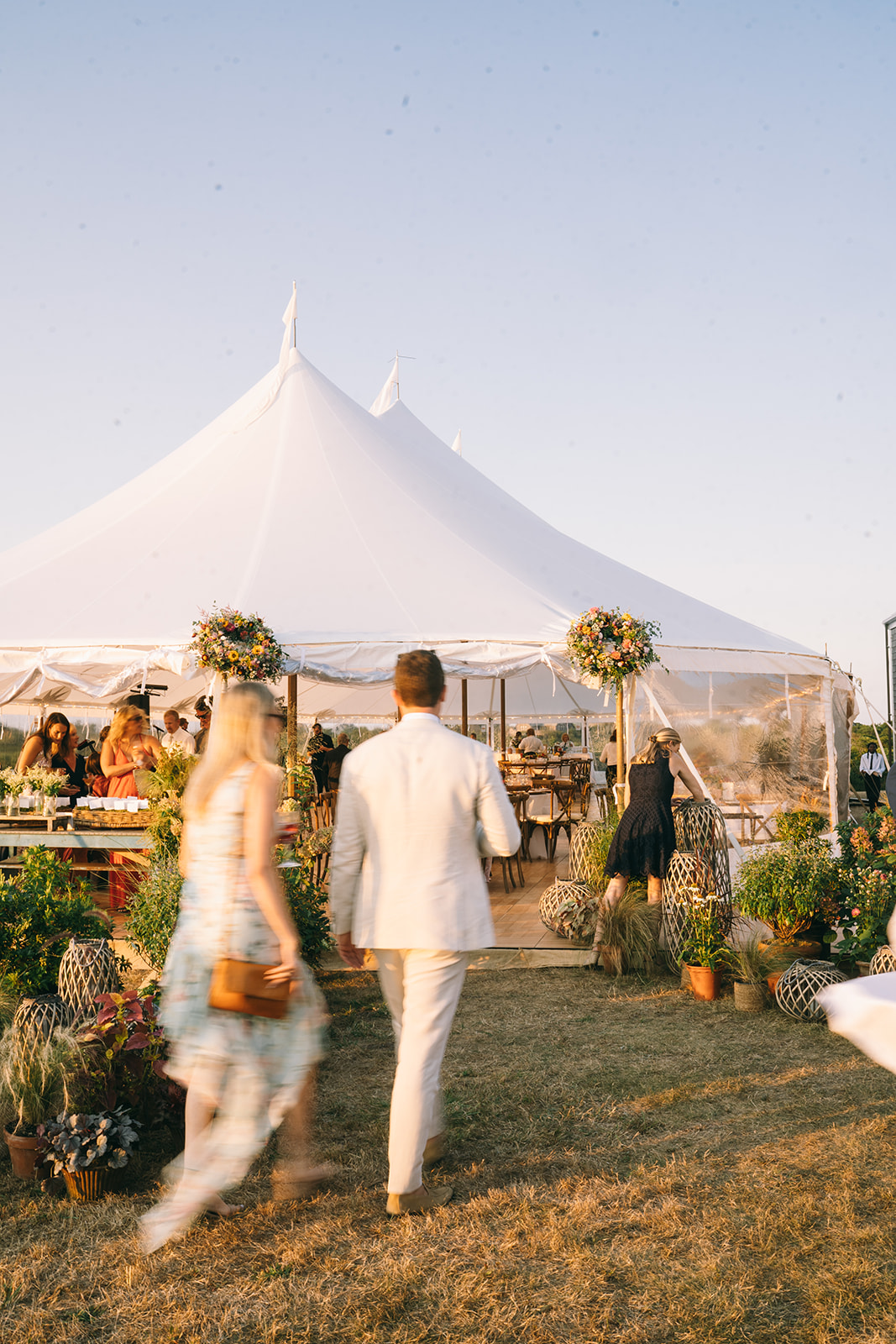 Wedding guests walking into reception tent at luxury Nantucket wedding