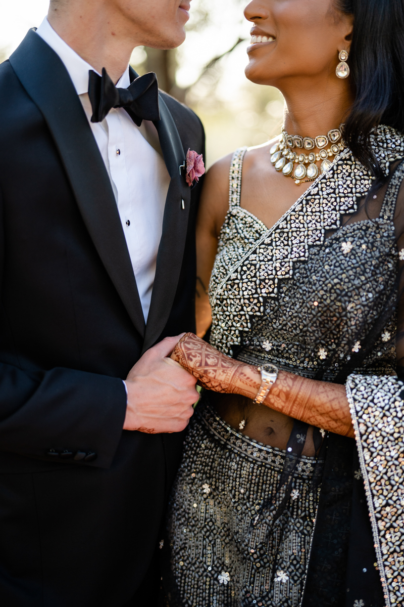 bride and groom reception outfit black and white indian