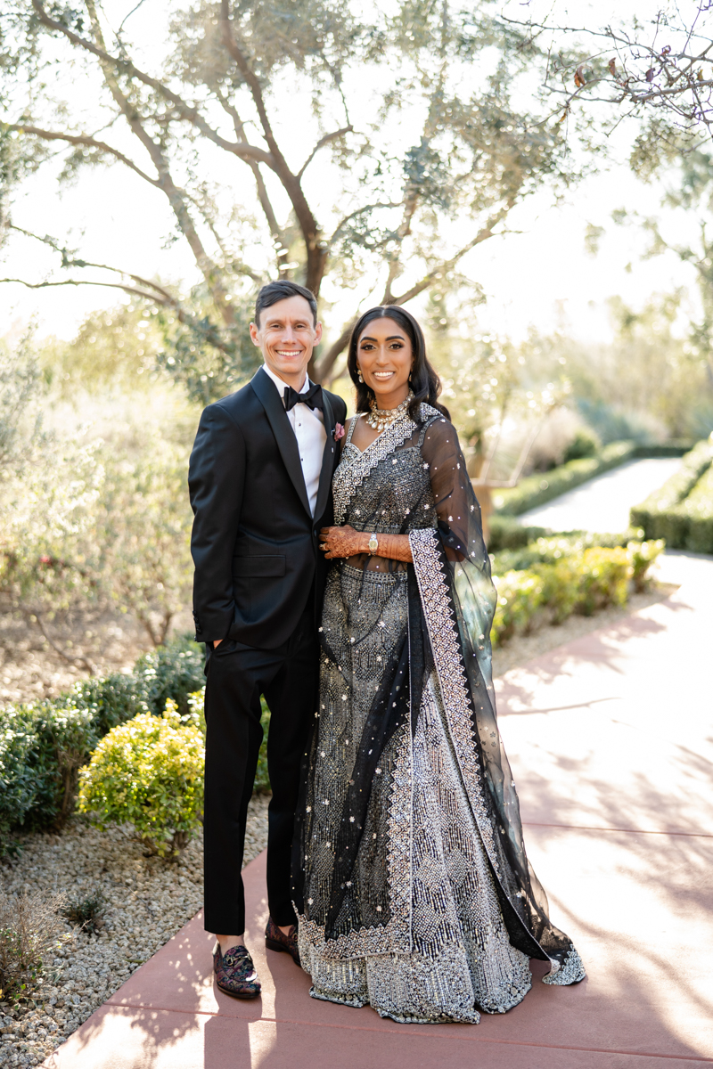 bride and groom reception outfit black and white indian