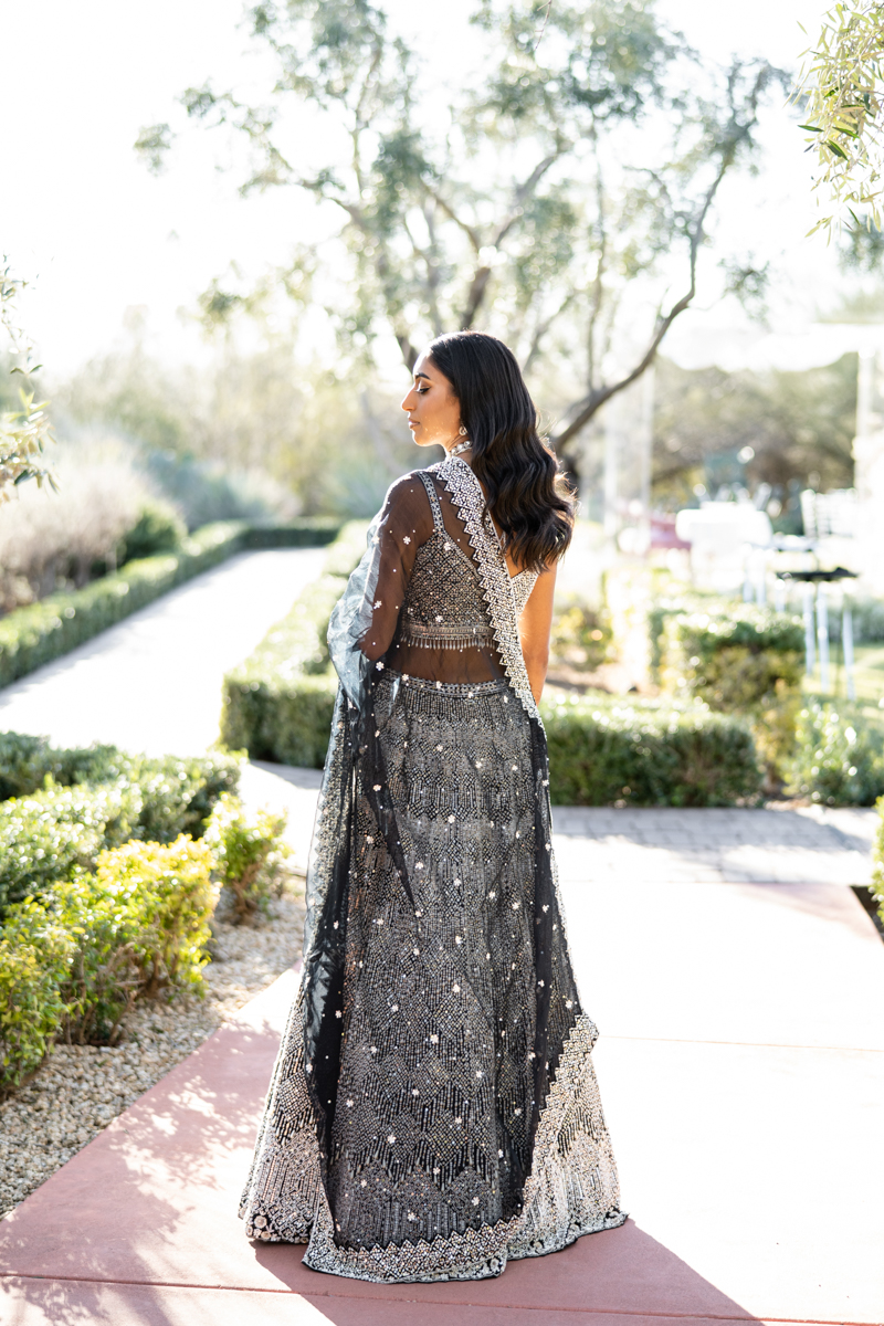 bride and groom reception outfit black and white indian