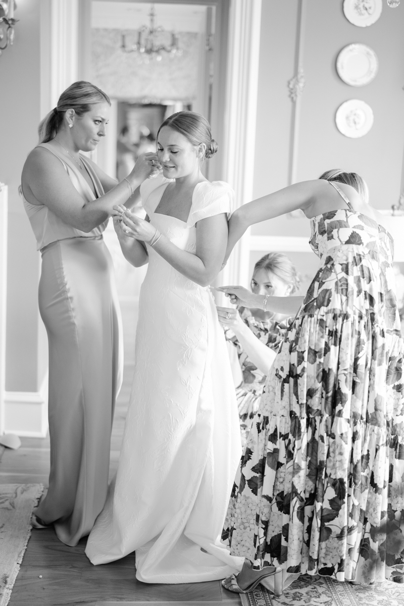 bride getting ready with bridesmaids