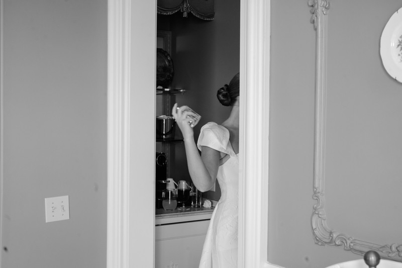 bride spraying perfume