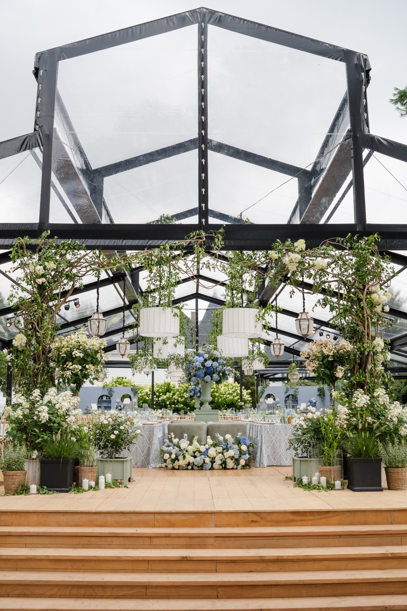 black steal tent wedding structure with cape cod garden aesthetic 