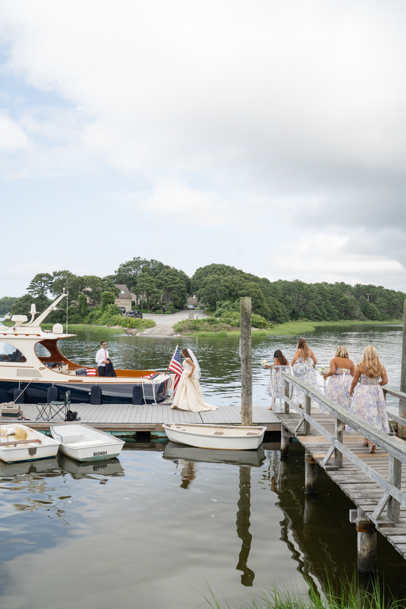 bridal party taking a boat to reception