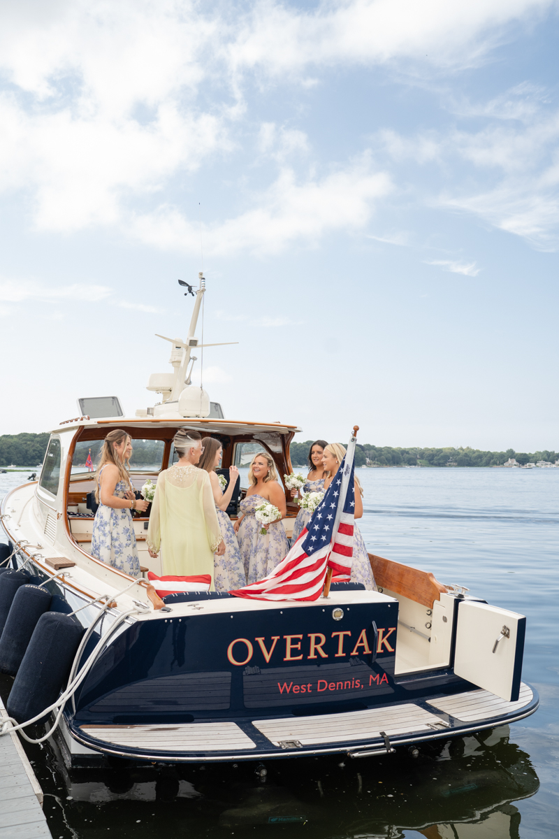 bridal party taking a boat to reception