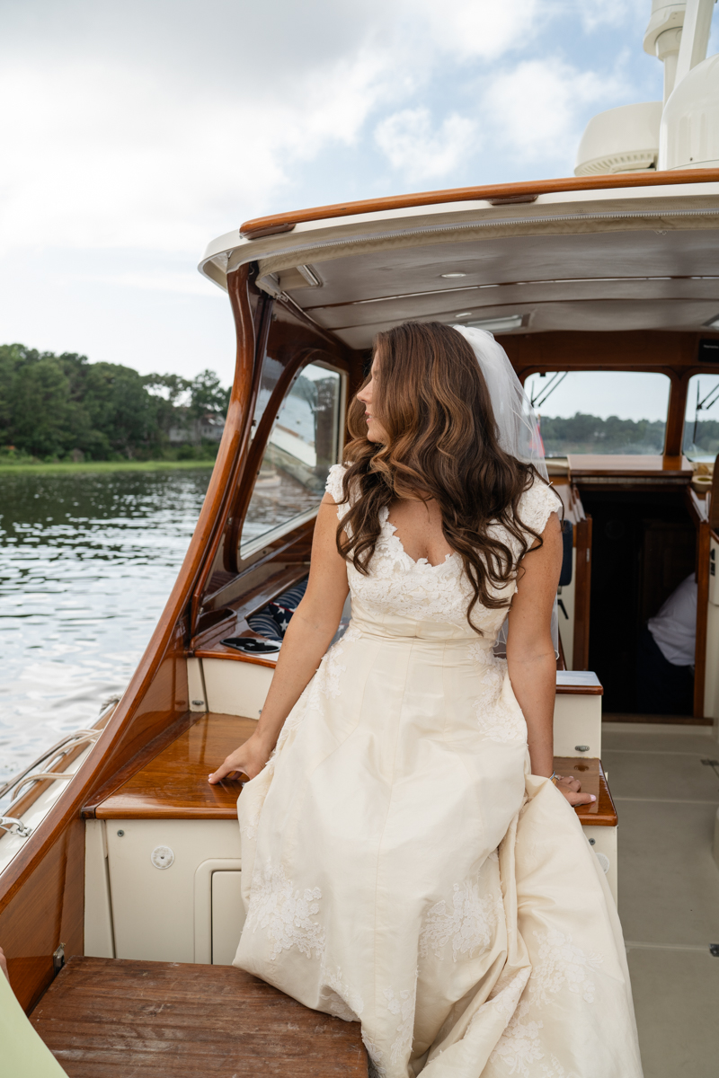 bridal party taking a boat to reception