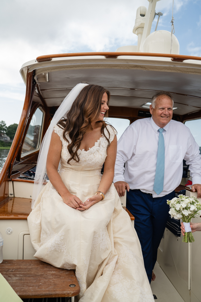 bridal party taking a boat to reception