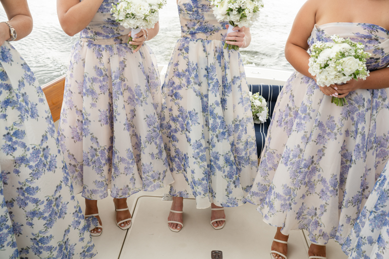 bridal party taking a boat to reception