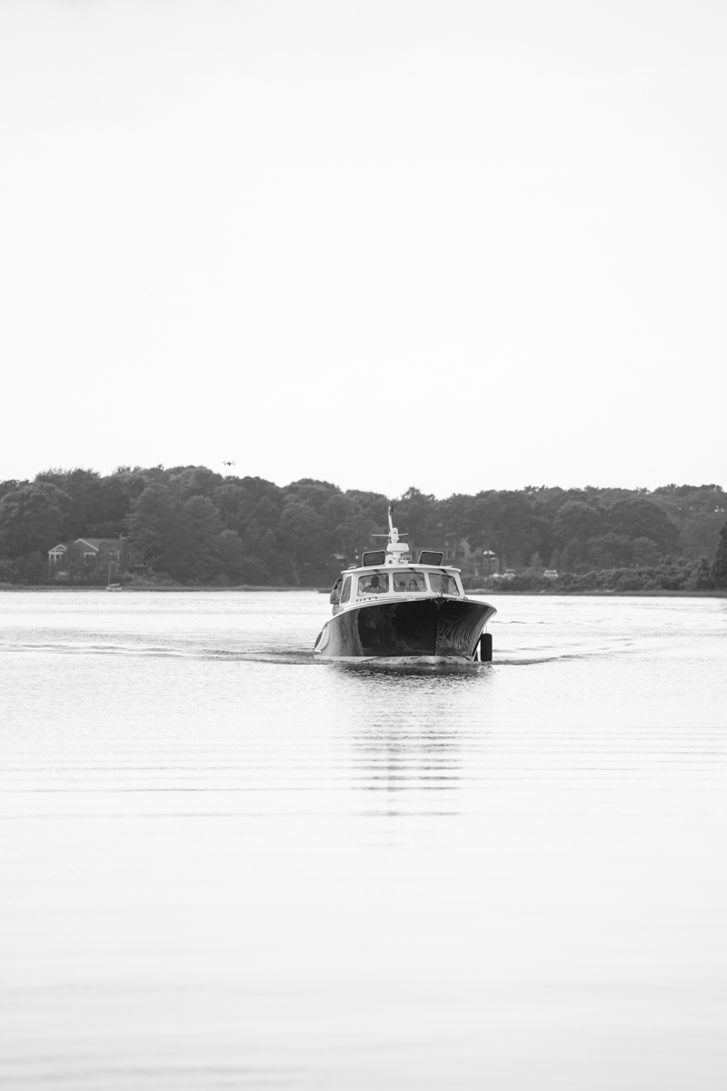 bridal party taking a boat to reception