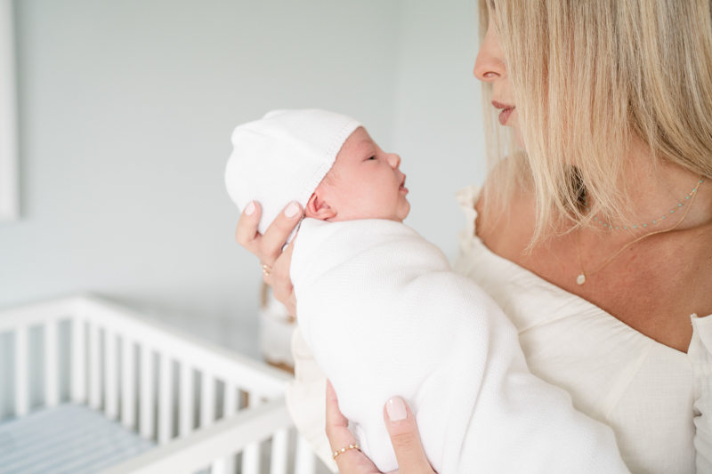 mom holding son