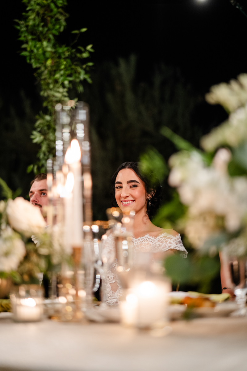 bride listening to speeches at reception