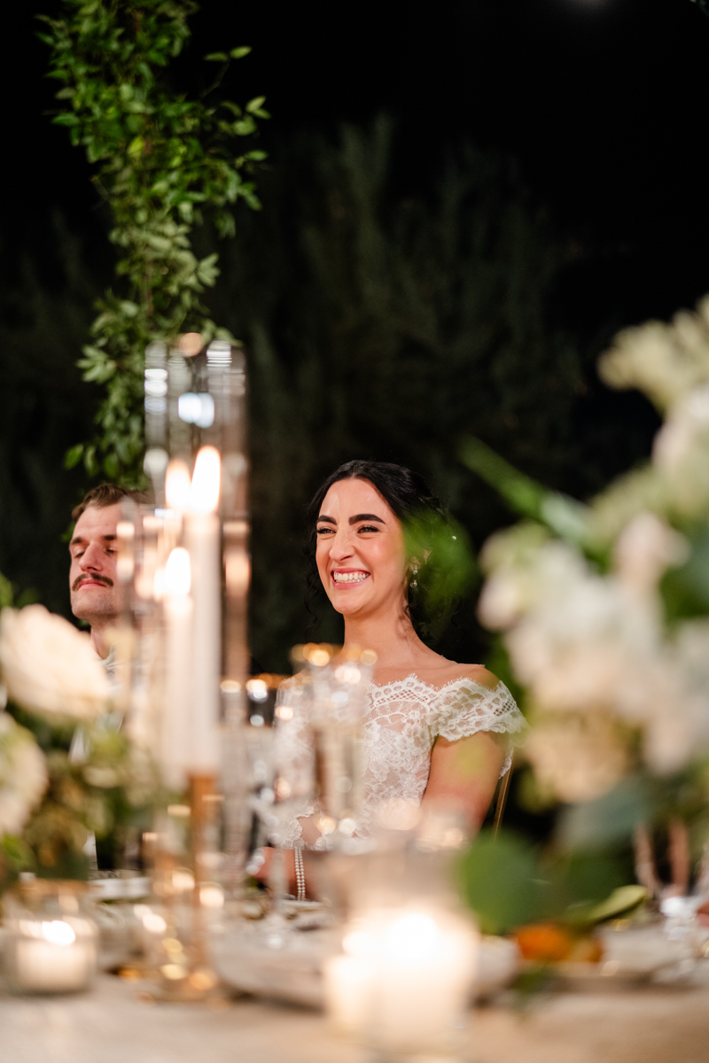 bride listening to speeches at reception