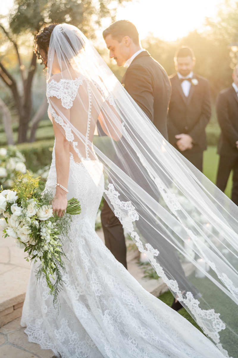 bride with veil at ceremony