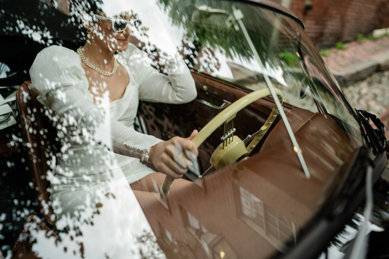 bride driving convertible Porsche