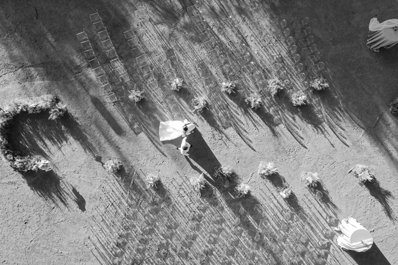 bride and groom in the desert drone photography