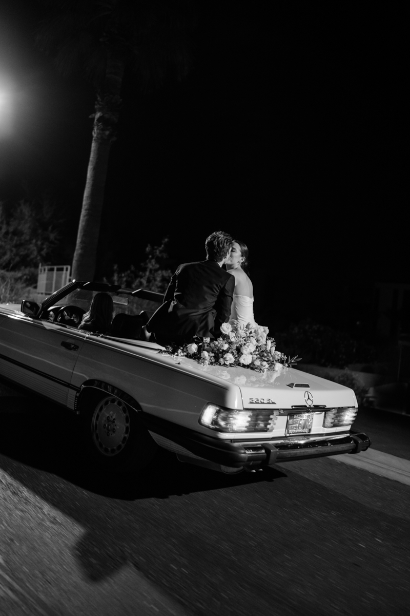 bride and groom in vintage Mercedes