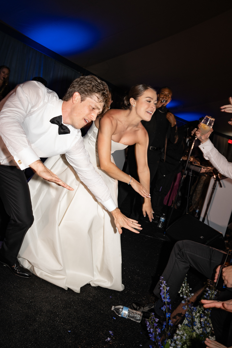 bride and groom singing on stage